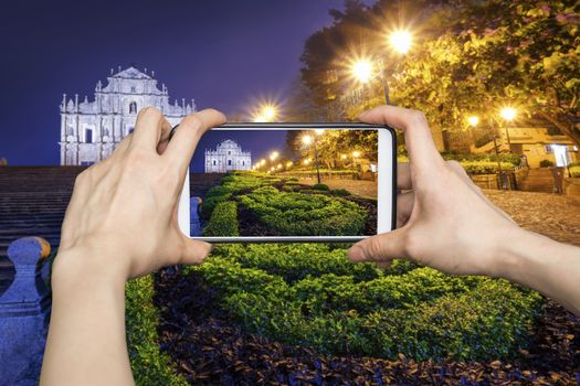 Taking pictures on mobile smart phone in Ruins of St. Paul's, Macau