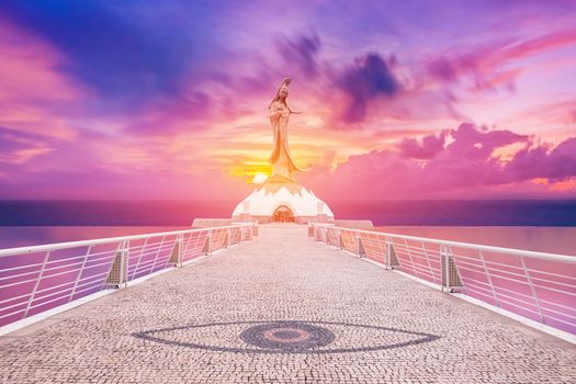 Statue of kun iam macau in sunset background