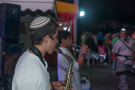 Safed, Israel - August 14, 2018: Scene of the Klezmer Festival, with street musicians and crowd. Safed (Tzfat), Israel. Its the 31st annual traditional Jewish festival in the public streets of Safed