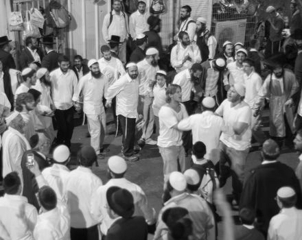 MERON, ISRAEL - MAY 18, 2014: Orthodox Jews dance at the annual hillulah of Rabbi Shimon Bar Yochai, in Meron, on Lag BaOmer Holiday. This is an annual celebration at the tomb of Rabbi Shimon