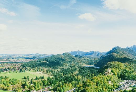 Beautiful nature of European Alps, landscape view of alpine mountains, lake and village in spring season, travel and destination scenery