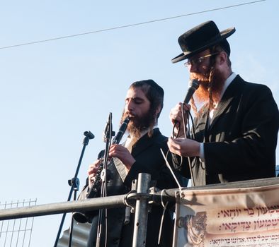 MERON, ISRAEL - MAY 18, 2014: Orthodox Jews play music and sing to the dancing crowd at the annual hillulah of Rabbi Shimon Bar Yochai, in Meron, on Lag BaOmer Holiday