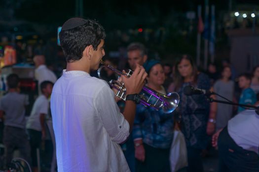 Safed, Israel - August 14, 2018: Scene of the Klezmer Festival, with street musicians and crowd. Safed (Tzfat), Israel. Its the 31st annual traditional Jewish festival in the public streets of Safed