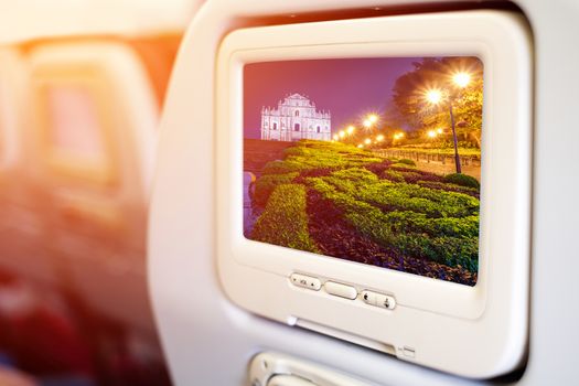 Aircraft monitor in passenger seat on Ruins of St. Paul's, one of Macau most famouse landmark 