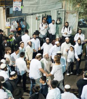 MERON, ISRAEL - MAY 18, 2014: Orthodox Jews dance at the annual hillulah of Rabbi Shimon Bar Yochai, in Meron, on Lag BaOmer Holiday. This is an annual celebration at the tomb of Rabbi Shimon