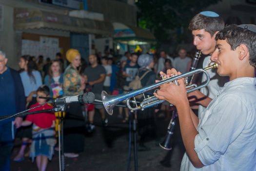 Safed, Israel - August 14, 2018: Scene of the Klezmer Festival, with street musicians and crowd. Safed (Tzfat), Israel. Its the 31st annual traditional Jewish festival in the public streets of Safed