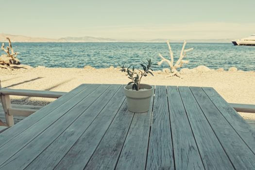 Empty restaurant by the Aegean sea and cruise boat, travel and nature, scene