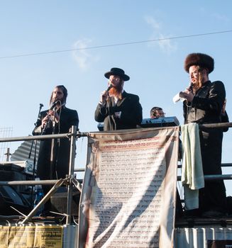 MERON, ISRAEL - MAY 18, 2014: Orthodox Jews play music and sing to the dancing crowd at the annual hillulah of Rabbi Shimon Bar Yochai, in Meron, on Lag BaOmer Holiday