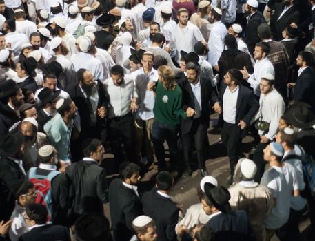 MERON, ISRAEL - MAY 18, 2014: Orthodox Jews dance at the annual hillulah of Rabbi Shimon Bar Yochai, in Meron, on Lag BaOmer Holiday. This is an annual celebration at the tomb of Rabbi Shimon