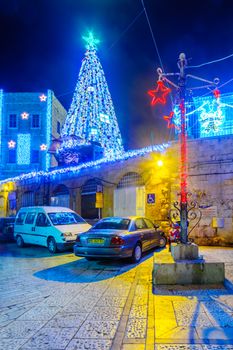 JERUSALEM, ISRAEL - DECEMBER 29, 2016: Alley with a Christmas tree and decorations, Jerusalem Old City, Israel