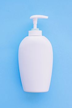 Blank label cosmetic container bottle as product mockup on blue background, hygiene and healthcare