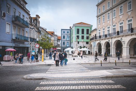 Aveiro, Portugal - May 7, 2018: People walking in a shopping street in the historic city center on a spring day