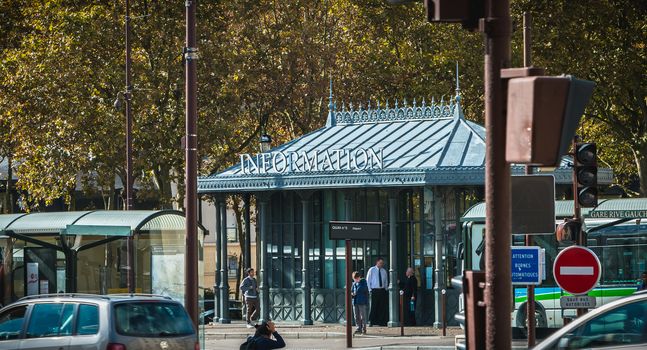 Versailles, France - October 9, 2017: People walking beside a touristic information office in the city center on a fall day