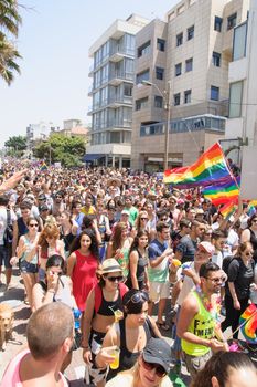 TEL-AVIV - JUNE 13, 2014: A crowd of people march in the Pride Parade in the streets of Tel-Aviv, Israel. The pride parade is an annual event of the gay community