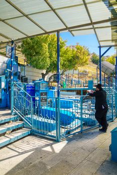 SAFED, ISRAEL - SEPTEMBER 18, 2015: Jewish man prays at the tomb of The ARI (Rabbi Isaac Luria), in Safed, Israel