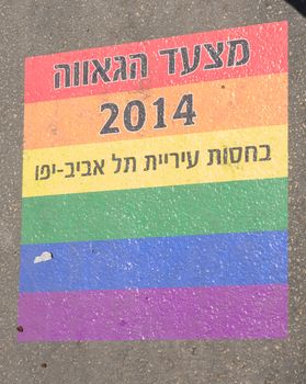 TEL-AVIV - JUNE 13, 2014: A printed sign on the street floor - Pride Parade 2014 Sponsored by the city of Tel Aviv. The pride Parade is an annual event of the gay community