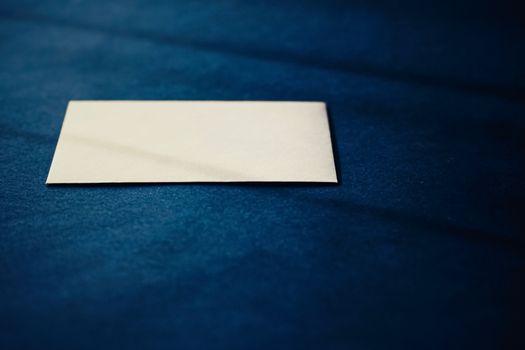 Blank beige paper card on blue background, premium business and luxury brand identity mockup