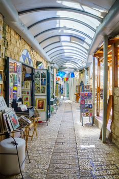 SAFED, ISRAEL - SEPTEMBER 18, 2015: An alley in the Jewish quarter, with local galleries and other businesses, locals and tourists, in Safed, Israel