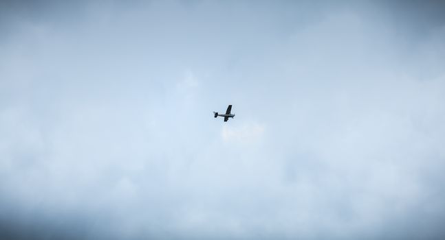 Port Joinville, France - September 16, 2018: Small passenger plane flying over Isle of Yeu near France on a fall day