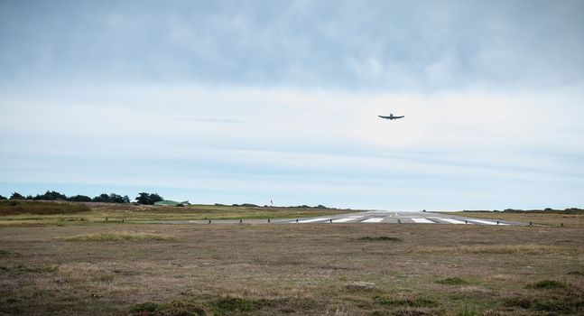 Port Joinville, France - September 16, 2018: Small passenger plane taking off from an airfield on Yeu Island near France on a fall day