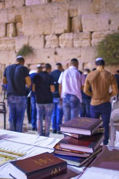 JERUSALEM, ISRAEL - SEPTEMBER 21, 2015: Jewish men pray Selichot (Jewish penitential prays) in the western wall, in the old city of Jerusalem, Israel