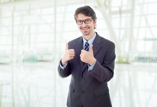 happy business man going thumb up, at the office