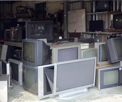KAOHSIUNG, TAIWAN -- OCTOBER 17, 2015: A local store for the repair and recycling of traditional and flat screen televisions.