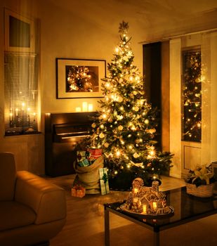 Christmas tree with burlap sack full of gift boxes in living room warm feeling 