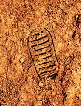 Astronaut bootprint on red soil Mars style background