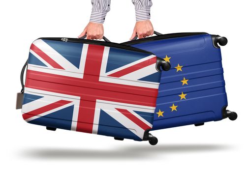 Hand holding modern suitcase UK Union Jack design. leaving EU isolated on white Brexit concept
