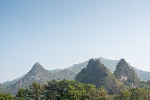 Karst formation and foggy limestone mountain landscape between Guiling and Yangshuo, Guangxi province, China