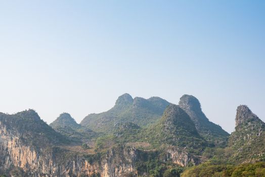Karst formation and foggy limestone mountain landscape between Guiling and Yangshuo, Guangxi province, China