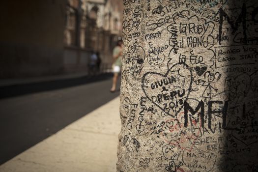 Verona, Italy, Europe, August 2019, Graffiti at the doorway to the house of Romeo