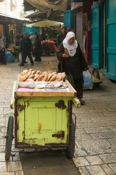 ACRE, ISRAEL - JANUARY 18, 2016: Market scene in the old city, with sellers and shoppers, in Acre, Israel