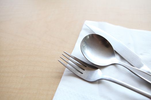 silverware on wood background