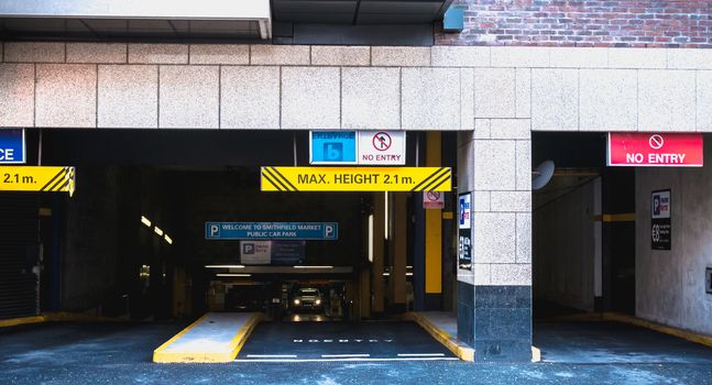 Dublin, Ireland - February 11, 2019: Entrance to underground parking in the city center on a winter day