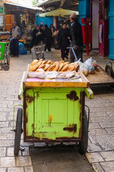 ACRE, ISRAEL - JANUARY 18, 2016: Market scene in the old city, with sellers and shoppers, in Acre, Israel