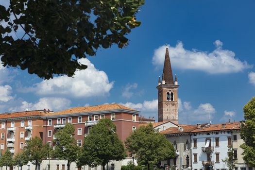 Verona, Italy, Europe, August 2019, view of the River Adige and the tower of the Chiesa Parrocchiale di Santa Maria in Organo