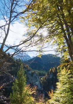 Beautiful nature of European Alps, landscape view of alpine mountains, lake and village on a sunny day, travel and destination scenery