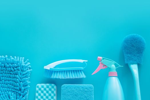 cleaning tools product supplies composition layout isolated on blue with copy space for template