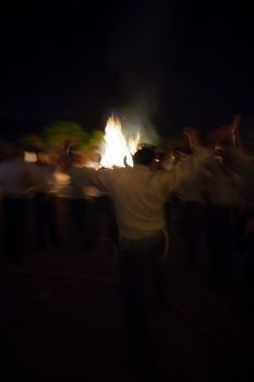 HAIFA, ISRAEL - MAY 01, 2010: Orthodox Jews dance around a bonfire to celebrate the Jewish holiday of Lad-BaOmer, in Haifa, Israel