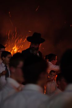 HAIFA, ISRAEL - MAY 01, 2010: Orthodox Jews dance around a bonfire to celebrate the Jewish holiday of Lad-BaOmer, in Haifa, Israel