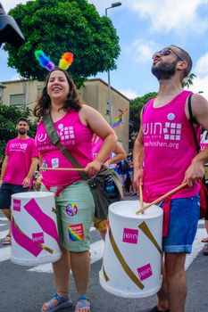 HAIFA, Israel - June 30, 2017: People play music, as part of the annual pride parade of the LGBT community, in the streets of Haifa, Israel