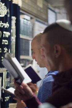 SAFED, ISRAEL - OCTOBER 03, 2014: Jewish men pray Selichot (request for forgiveness) at the tomb of Rabbi Yehuda Bar Ilai, on Yom Kippur eve, in Safed, Israel.