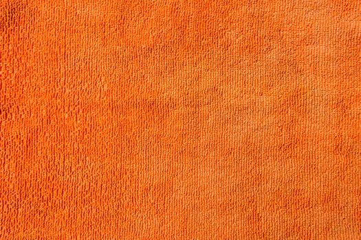 texture orange towel placed on background