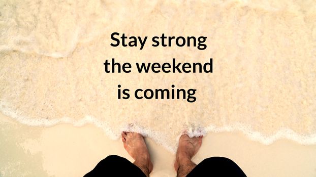 typography motivational messages and inspirational quotes. man's feet stand on sand beach with phrase stay strong the weekend is coming