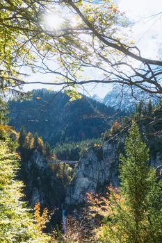 Beautiful nature of European Alps, landscape view of alpine mountains, lake and village on a sunny day, travel and destination scenery