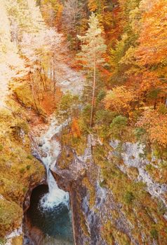 Beautiful nature of European Alps, landscape view of alpine mountains, lake and village in autumn season, travel and destination scenery