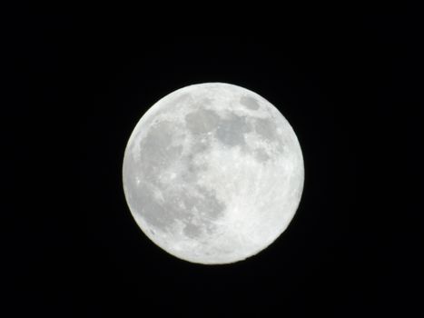 Beautiful caption of the moonlight over the village in winter days with some trees and leaves in the background by night and by day.