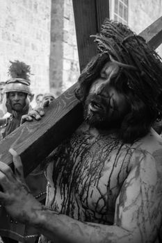 JERUSALEM-MARCH 29: Catholic Good Friday - a group of actors presenting the crucifixion of Christ near Church of the Holy Sepulchre in Old City, Good Friday March 29, 2013 in Jerusalem, Israel